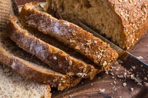Close up of sliced whole grain bread with visible seeds and grains Stock Photos