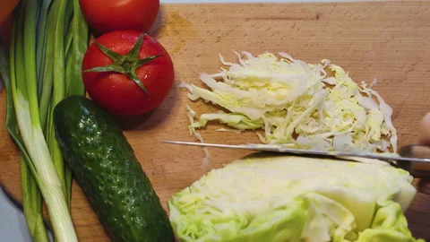 Close up. Slicing cabbage for salad. Slow motion Stock Footage 152794197