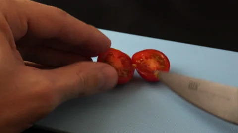 Close up on slicing cherry tomato 4K Stock Footage 47244408
