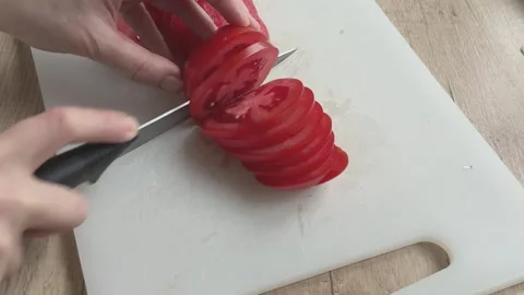 Close Up Slicing Fresh Tomato With Knife On White Board Cooking Ingredients Stock Footage 336445695
