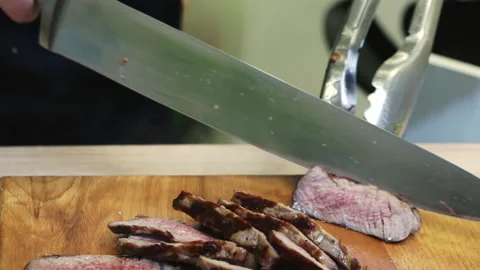 Close-up of slicing fried meat steak. Stock Footage 171624809