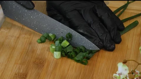 Close-Up of Slicing Green Onion with Kitchen Knife Stock Footage 311318398