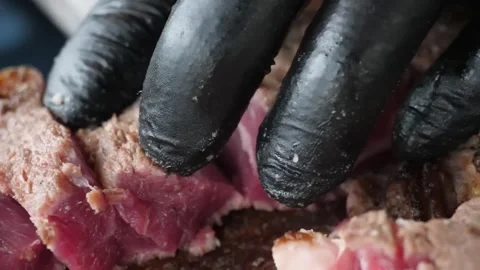 Close-up of Slicing Juicy Medium-Rare Grilled Beef Steak on Wooden Board Stock Footage 338210999
