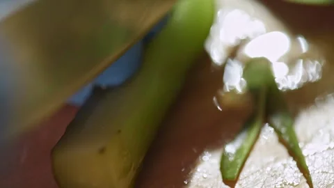 Close-up of slicing pickled cucumbers for preparing a dish. Stock Footage 149070104