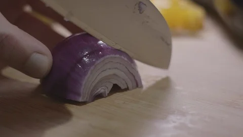 Close Up of Slicing Red Onion Stock Footage 128994297
