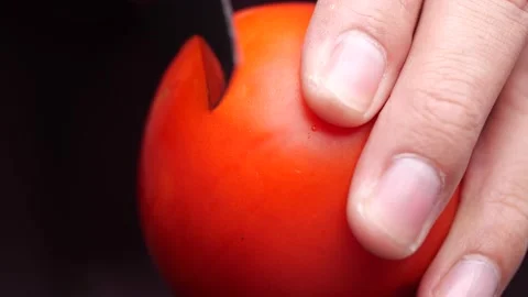 Close-up of slicing red tomato Stock Footage 134103205