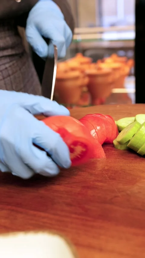 Close-up of Slicing Red Tomato for Salad, Vertical Video Stock Footage 288577894