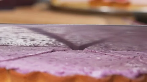 Close-up of Slicing a Vibrant Blueberry Mousse Pie or Purple Ube Cheesecake Stock Footage 337751211