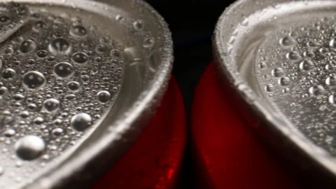Close-up of a slide along a row of cola cans. Stock-Footage 147669771