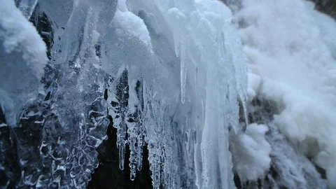 Close up slide on icicles at waterfall, Carpathian mountains, Ukraine Stock Footage 128812440