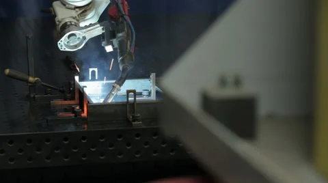 Close-up slide right to left welding robots work Stock Footage 47486483