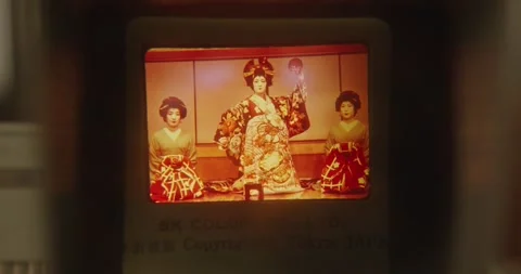 A close-up of a slide viewer on whose screen a pictures of Japanese Stock Footage 245257438