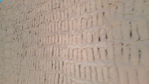 Close up slider motion of ancient pre-Inca adobe brick wall texture Stock Footage 341270713