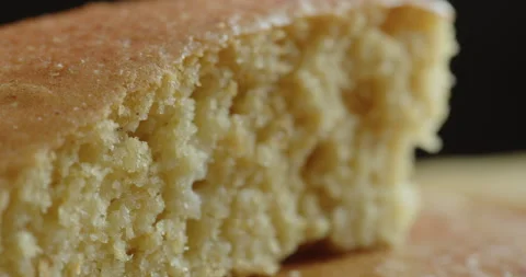 Close-up sliding on baked cornbread 4K footage Stock Footage 249027434