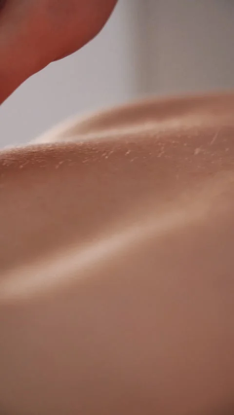 Close-up of sliding fingers on the back Stock Footage 309203504