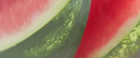 Close-up sliding by sliced watermelon fruit 4K scope video Stock Footage 313601668