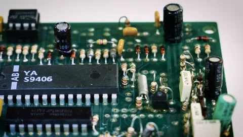 Close-up sliding video of printed circuit board - ic, resistor,capacitor. 4k Stock Footage 123540549