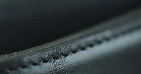 Close-up sliding while pulling focus on black belt 4K video Stock Footage 260355040