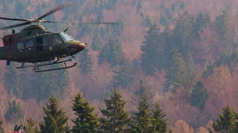 Close up Slovenian Armed Forces helicopter with a specialized bucket Stock Footage 182399028