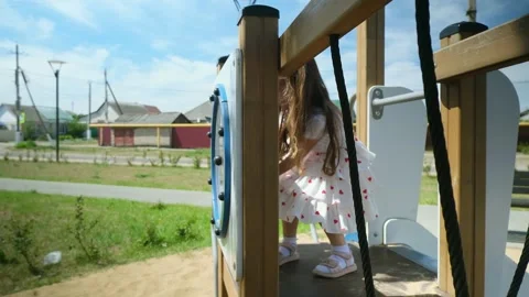 Close up slow mo, as inquisitive 4 year old caucasian girl is seen exploring the Stock Footage 278739658