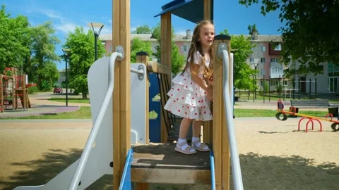 Close up slow mo, as inquisitive 4 year old caucasian girl is seen exploring the Stock Footage 279073938