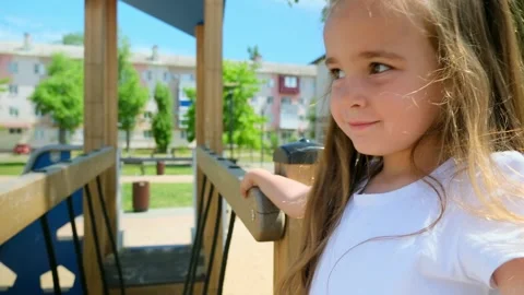 Close up slow mo, as inquisitive 4 year old caucasian girl is seen exploring the Stock Footage 279073953