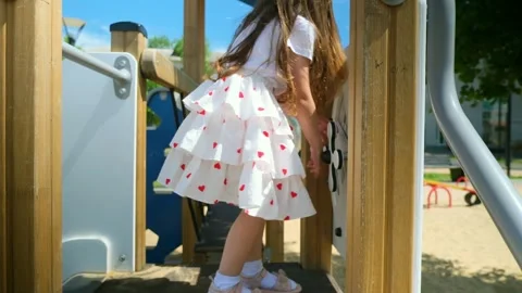 Close up slow mo, as inquisitive 4 year old caucasian girl is seen exploring the Stock Footage 281103984