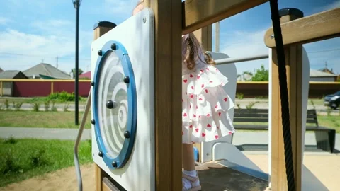 Close up slow mo, as inquisitive 4 year old caucasian girl is seen exploring the Stock Footage 282082849