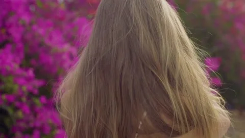Close-up slow motion beautiful long-haired caucasian girl model Stock Footage 145347978