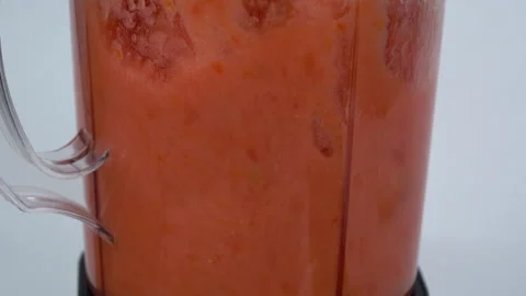 Close up slow motion, blending tomato juice, blending like a storm. Видео 137769395