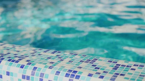 Close-up, slow motion blue turquoise water with highlights in the swimming pool  Stock Footage 120346843