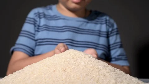 Close up slow motion boy smell white rice Stock Footage 86636488
