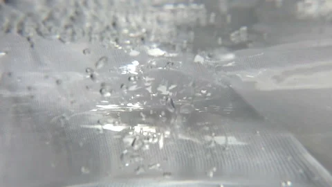 Close up slow motion bubbles under water Stock Footage 114125688