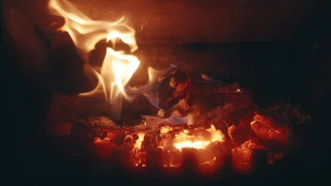 Close-Up Slow Motion of Burning Firewood and Flickering Flames in a Fireplace Stock Footage 342379271