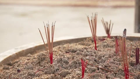 Close up slow motion of burning smoke Incense sticks. Altar at the entrance to Stock Footage 293748259
