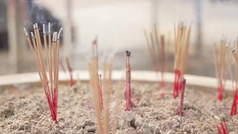 Close up slow motion of burning smoke Incense sticks. Altar at the entrance to Stock Footage 293748287