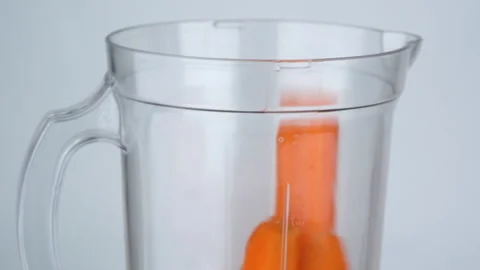 Close up slow motion, carrots fall into the blender, preparing to blend. Stock-Footage 137769390