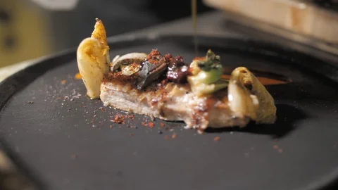 Close up. Slow motion. Chef hands pour sauce on appetizing served Italian dish Stock Footage 88673658