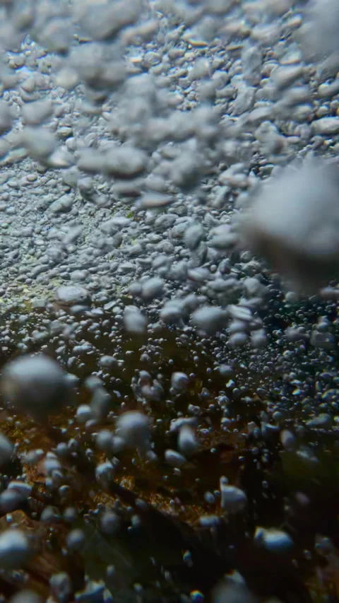 Close-up, slow-motion of churning aerated bubbles water flow Stock Footage 338133359