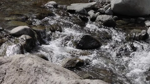 Close-up slow motion of a crystal clear river stream in Mount Kintoki, Odawara Stock Footage 328627115