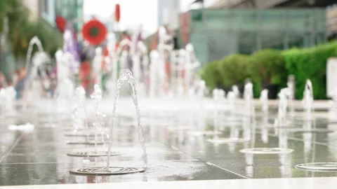 Close up slow motion of Dancing Urban Water Fountain Jets Spraying in Public Stock Footage 314356365