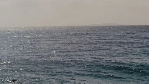 Close-up slow motion of a disturbed blue ocean water surface. Nice loop backgrou Stock Footage 234420743