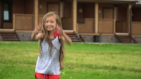 Close up slow motion dolly shot. A bit the fair-haired girl is turned around Stock Footage