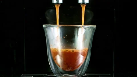 Close-up Slow Motion of Espresso Pouring from Coffee Machine. Stock Footage 142602428