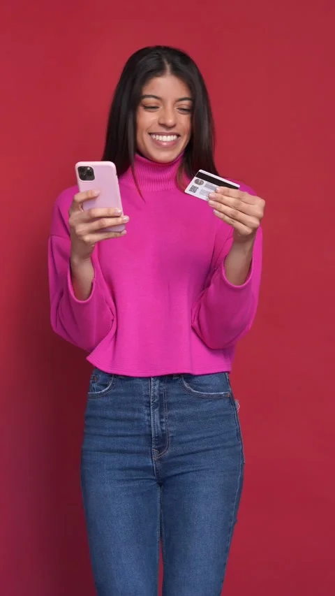 Close up slow motion face of young woman, isolated on red background Stock Footage 233461420