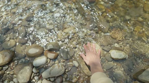 Close up slow motion female hands taking fresh cold clean water in palms from Stock Footage 224485875