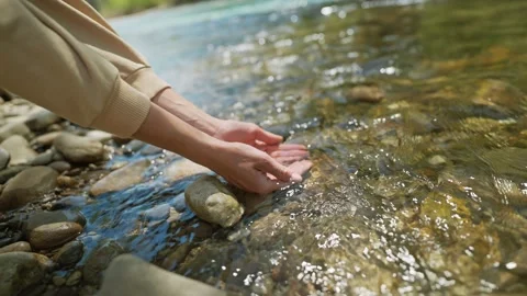 Close up slow motion female hands taking fresh cold clean water in palms from Stock Footage 224486140