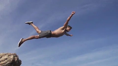 Close Up Slow Motion Flip Cliff Jump in the Air Stock Footage 55294675