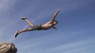 Close Up Slow Motion Flip Cliff Jump In The Air Stock Footage