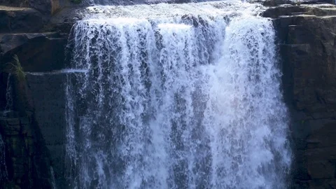 Close up slow motion focused on top of waterfall with water rippling over Stock Footage 81416227